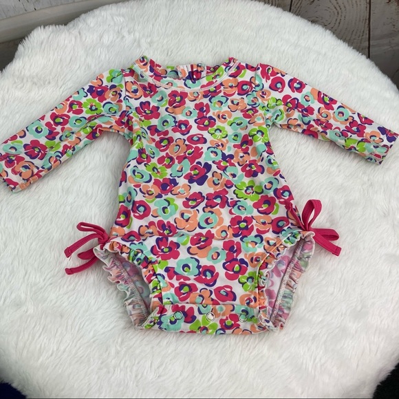 Ruffle Butts Other - Floral long sleeved rashguard swim suit